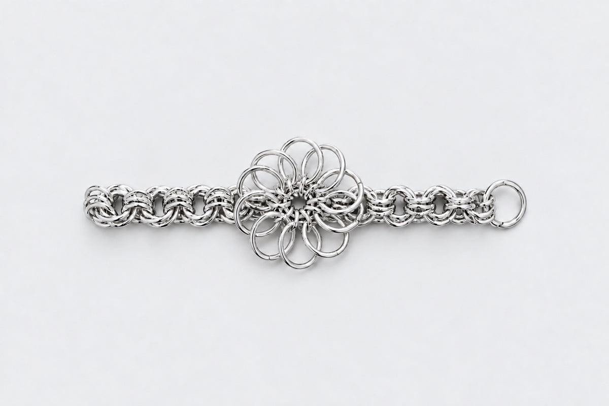 SARAH BOUNAB Abyssal Bloom bracelet with an oversized flower made of stainless steel rings, handmade in Switzerland.