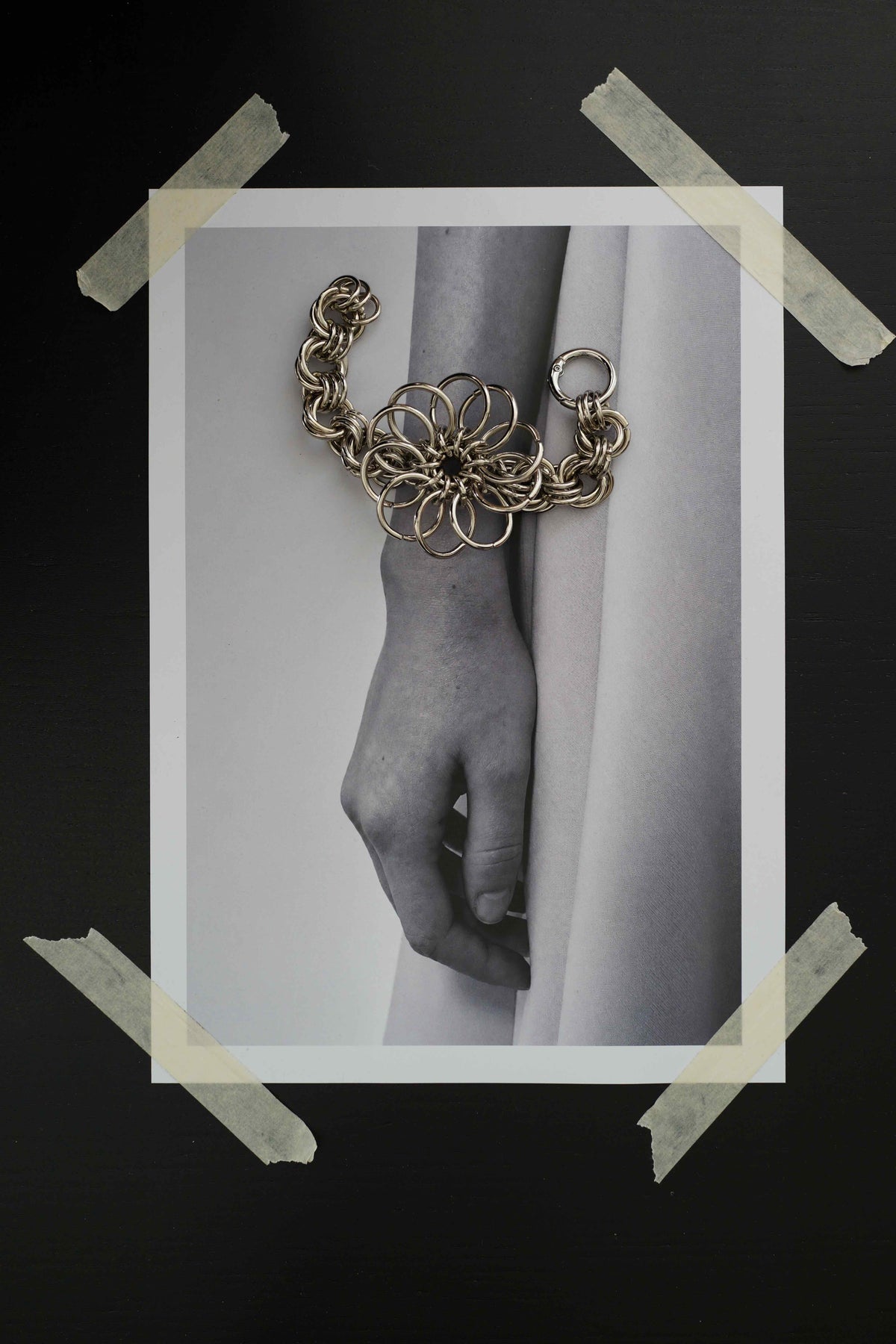 SARAH BOUNAB Abyssal Bloom bracelet with an oversized flower made of stainless steel rings, handmade in Switzerland.