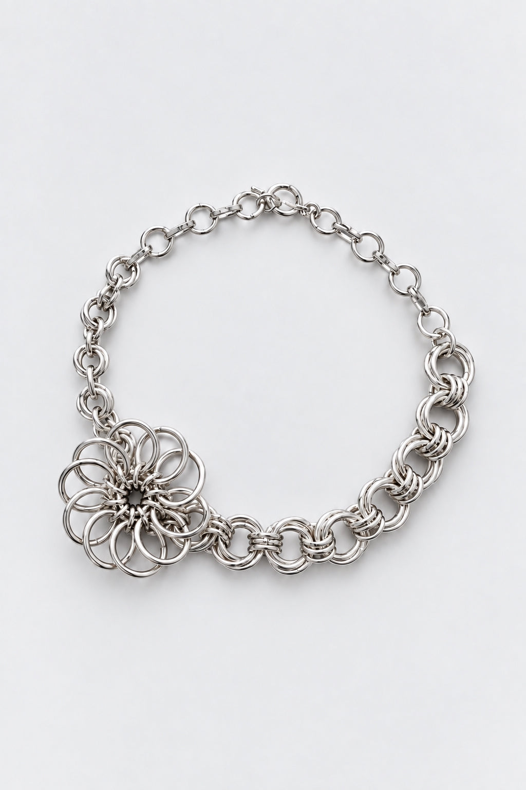 SARAH BOUNAB “Abyssal Bloom” flower necklace made of silver-plated stainless steel rings, hand-assembled in Switzerland.