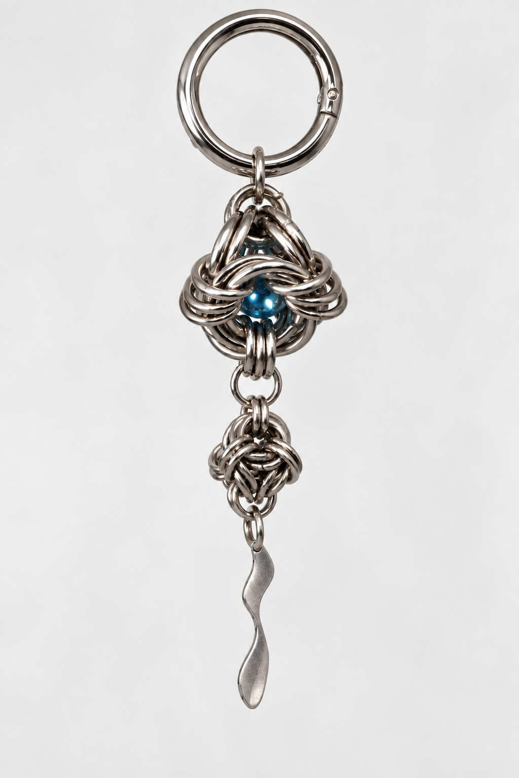 SARAH BOUNAB “Abyssal Orbit” keychain made of stainless steel, with a mirror-blue bead and an aluminum pendant, handmade in Switzerland.