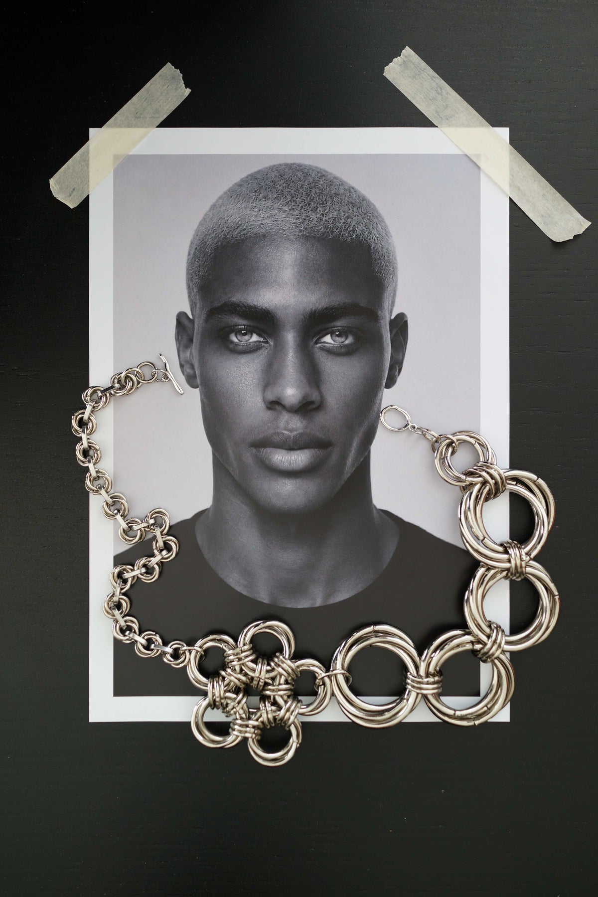 SARAH BOUNAB “Abyssal Thorn” necklace in stainless steel with metal knots and a polished aluminum petal pendant.