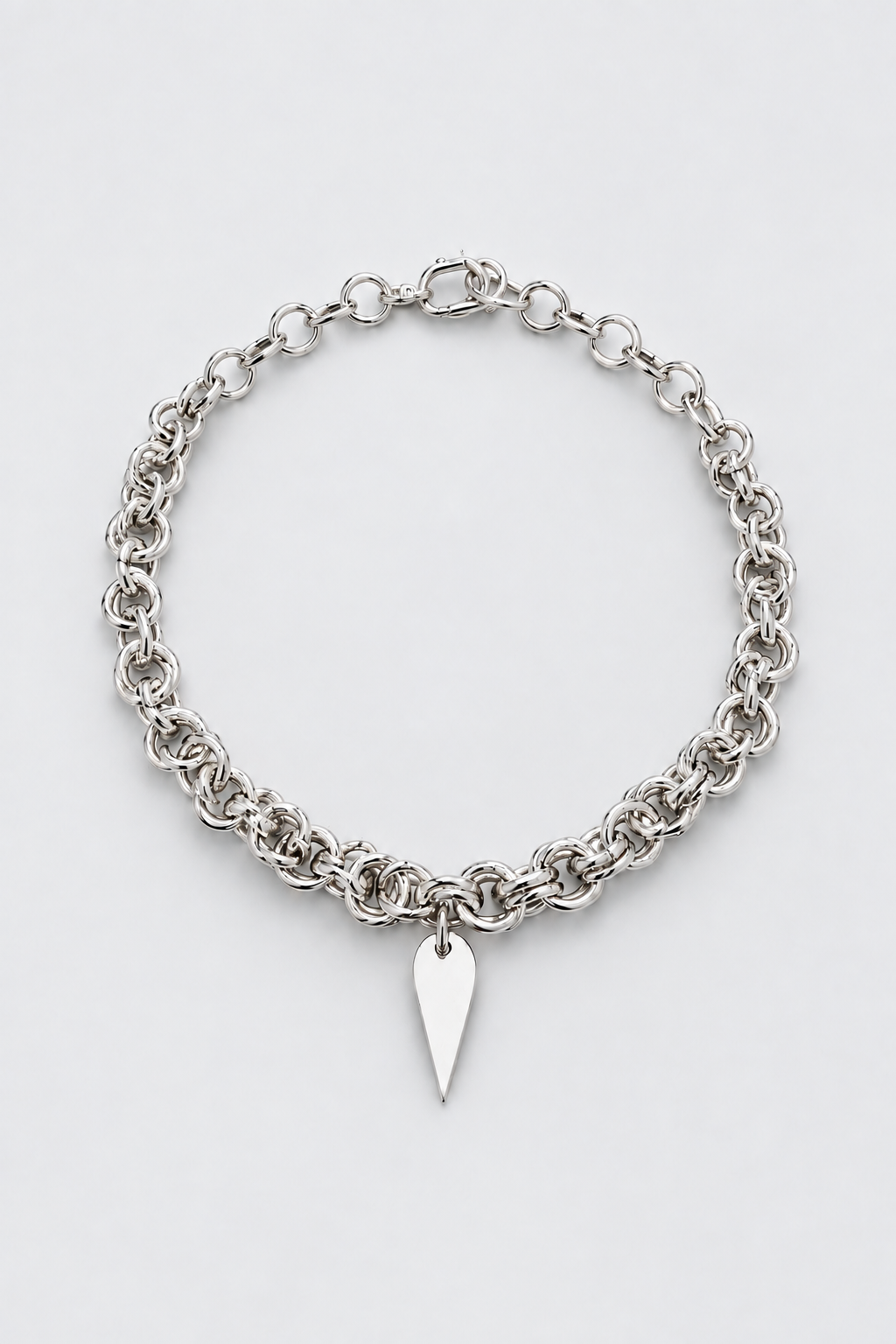 Eclipse Bloom SARAH BOUNAB asymmetrical necklace with a flower and large rings in silver-plated stainless steel.