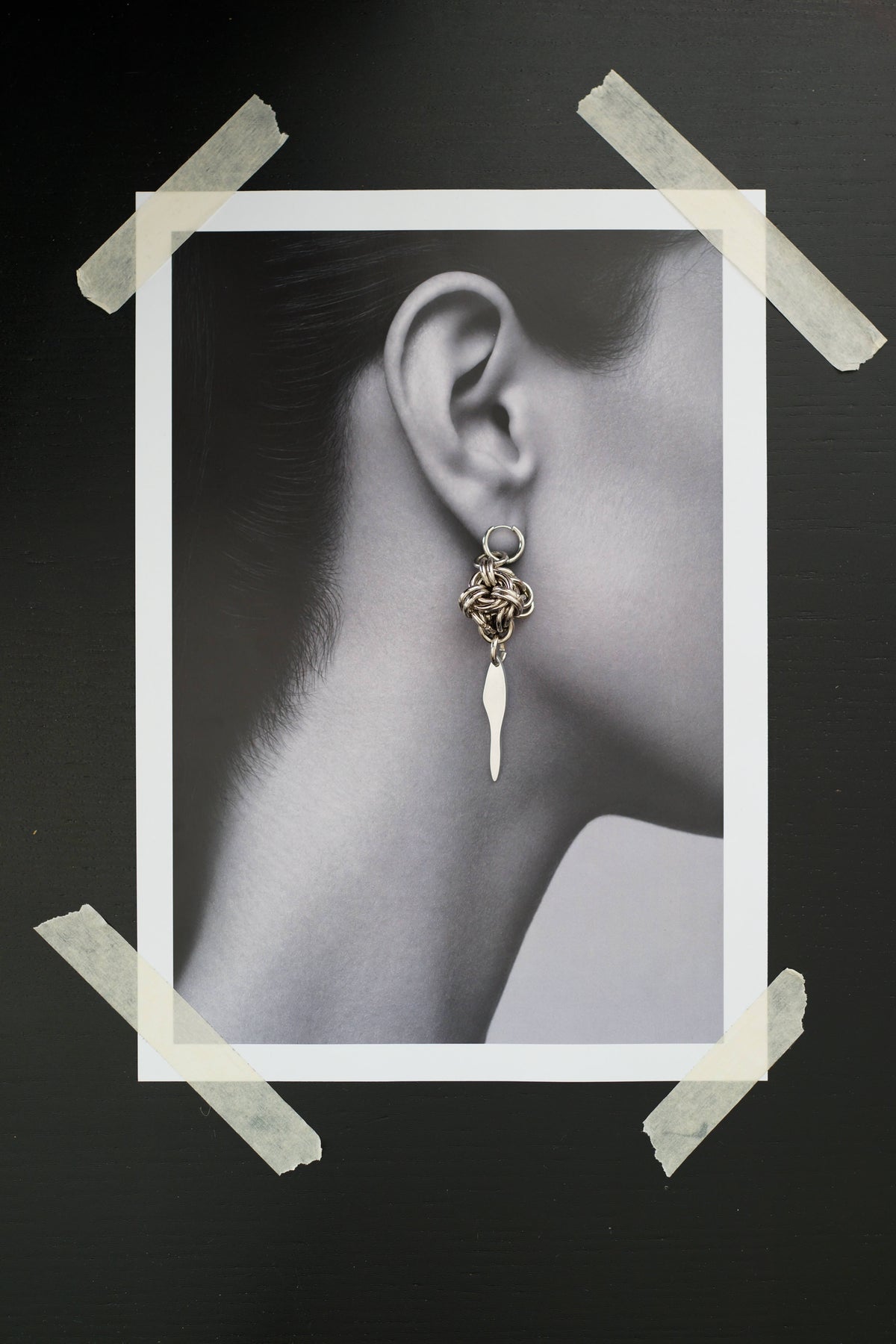 SARAH BOUNAB Knot Blade Earrings with stainless steel knots and long aluminum blades.