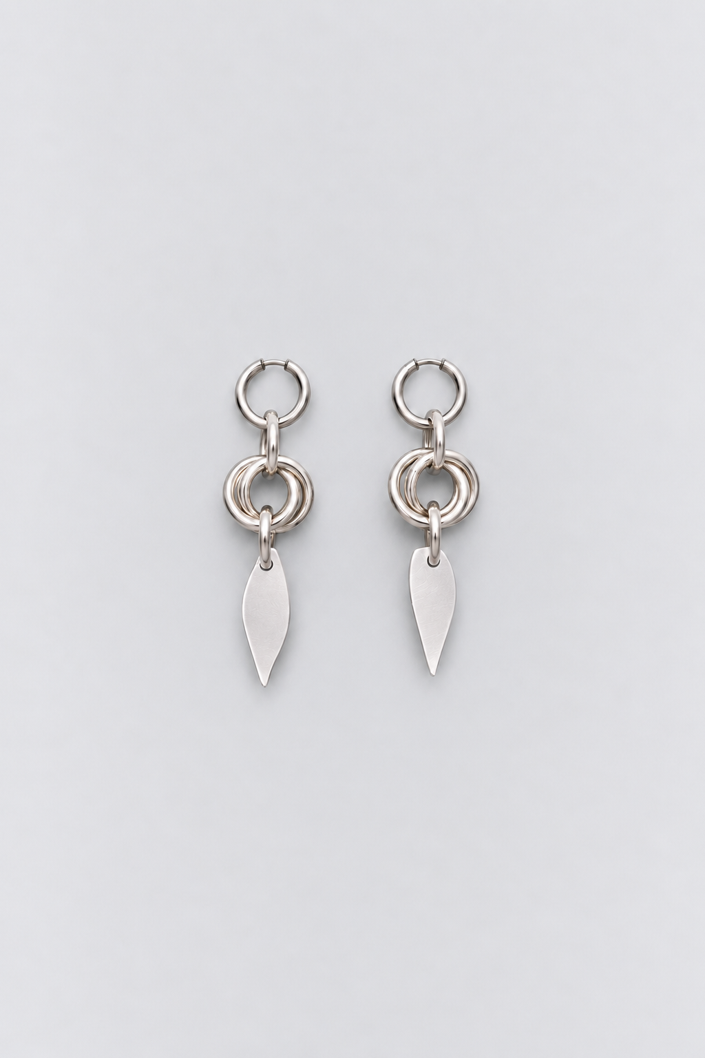 SARAH BOUNAB Orbit Petal Earrings featuring stainless steel rings with an aluminum petal pendant.
